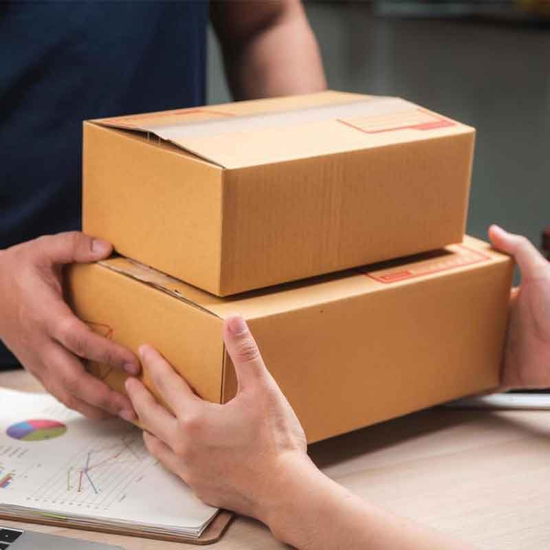 Courier handing over two parcels